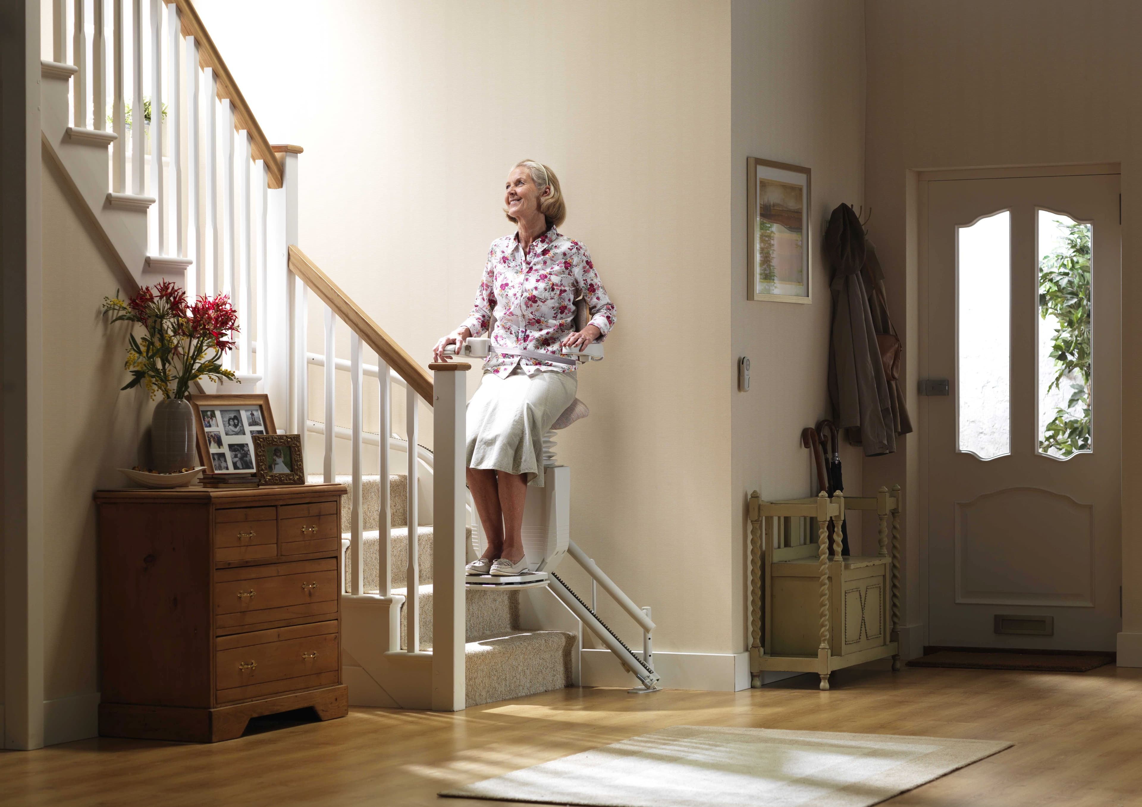 Woman riding stairlift